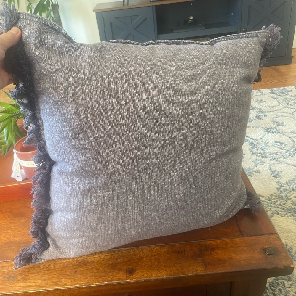 Navy blue heather pillow with fridges on side 18x18